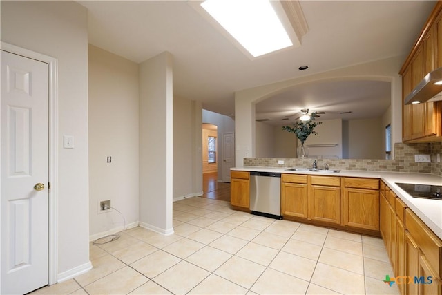 kitchen with backsplash, stainless steel dishwasher, black electric cooktop, sink, and light tile patterned flooring