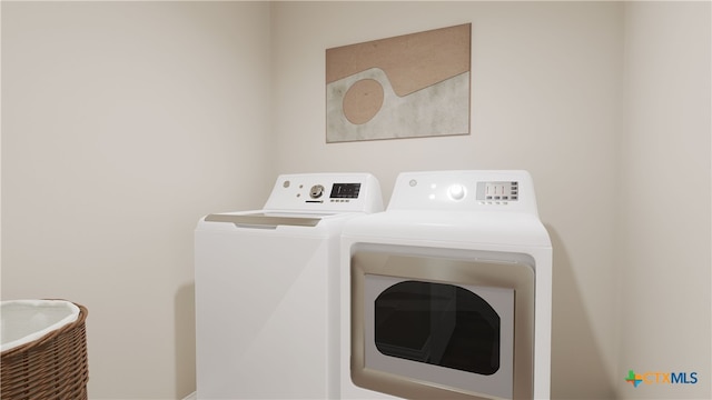 clothes washing area featuring washing machine and dryer