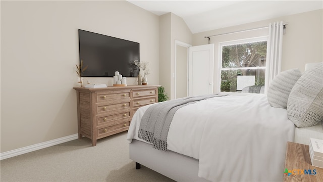 bedroom with light colored carpet and lofted ceiling