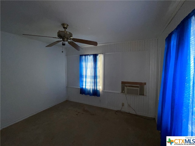 spare room with carpet and ceiling fan