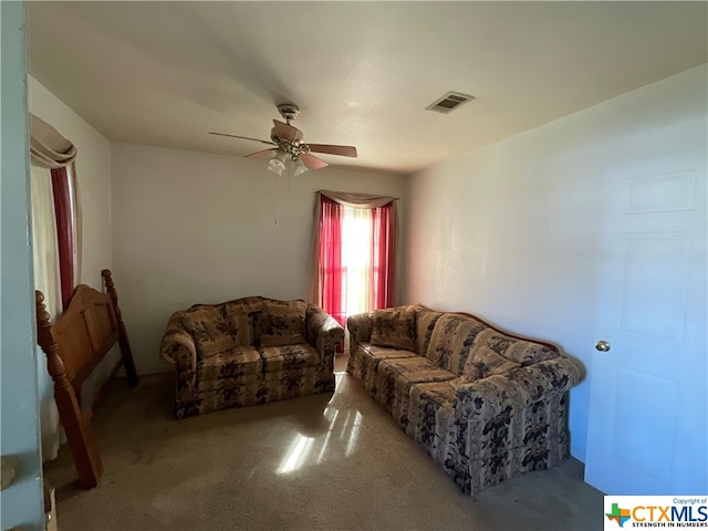 living room featuring carpet and ceiling fan