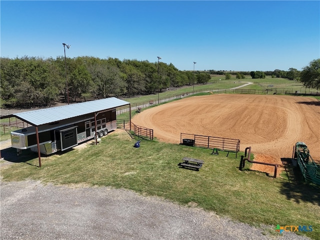 view of community featuring an outbuilding and a rural view