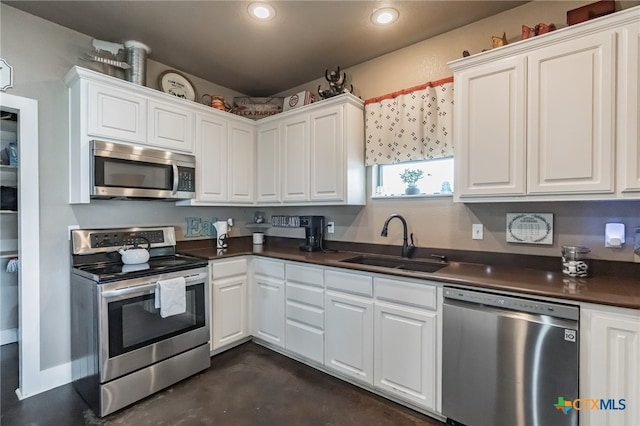 kitchen featuring white cabinets, sink, and appliances with stainless steel finishes