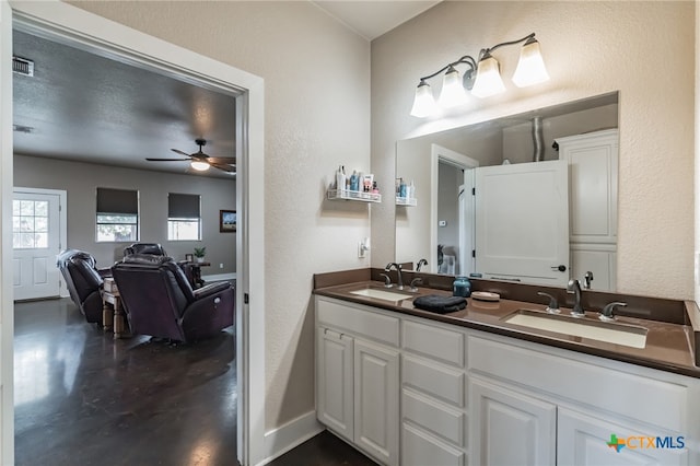 bathroom featuring ceiling fan and vanity