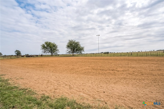 view of yard with a rural view