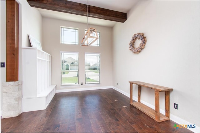 3814 Twilight Dr, Temple, TX 76502 - unfurnished dining area featuring dark wood-type flooring, beamed ceiling, plenty of natural light, and a towering ceiling