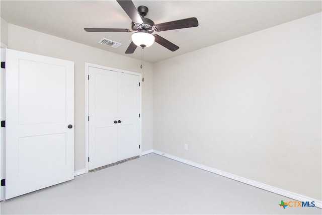 3814 Twilight Dr, Temple, TX 76502 - unfurnished bedroom featuring a closet, finished concrete flooring, and ceiling fan