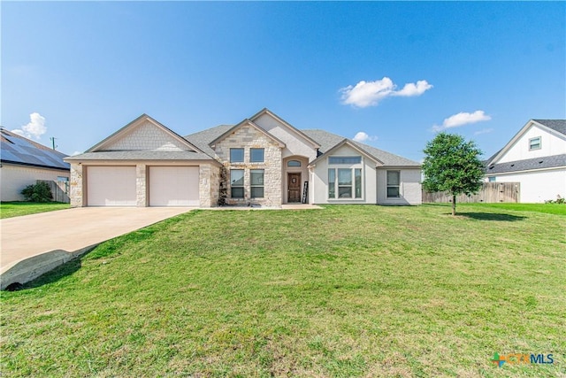 3814 Twilight Dr, Temple, TX 76502 - view of front of home featuring an attached garage, stone siding, and driveway