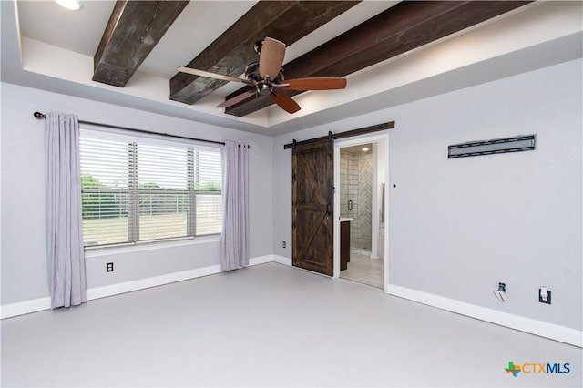 3814 Twilight Dr, Temple, TX 76502 - unfurnished bedroom with a barn door, concrete floors, ensuite bathroom, and a ceiling fan