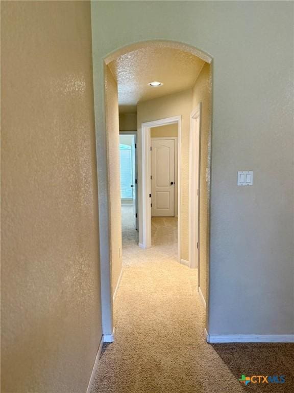 3508 Lucas St, Copperas Cove, TX 76522 - hall with arched walkways, carpet flooring, and baseboards