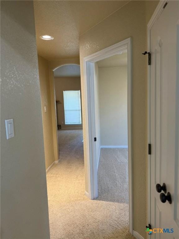 3508 Lucas St, Copperas Cove, TX 76522 - hallway featuring carpet, arched walkways, baseboards, and recessed lighting