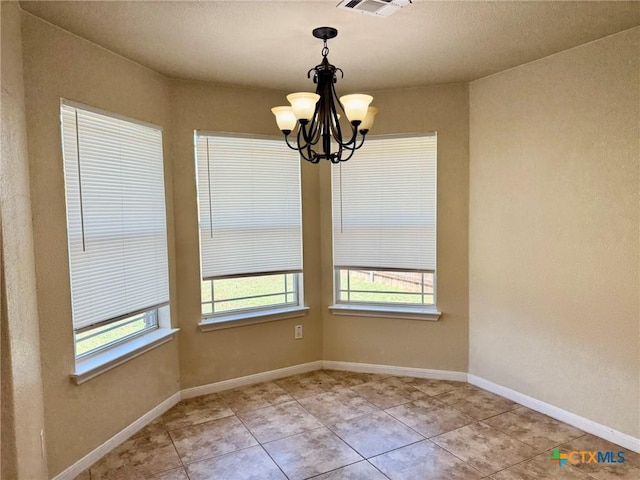 3508 Lucas St, Copperas Cove, TX 76522 - unfurnished dining area with healthy amount of natural light, a chandelier, light tile patterned floors, and baseboards