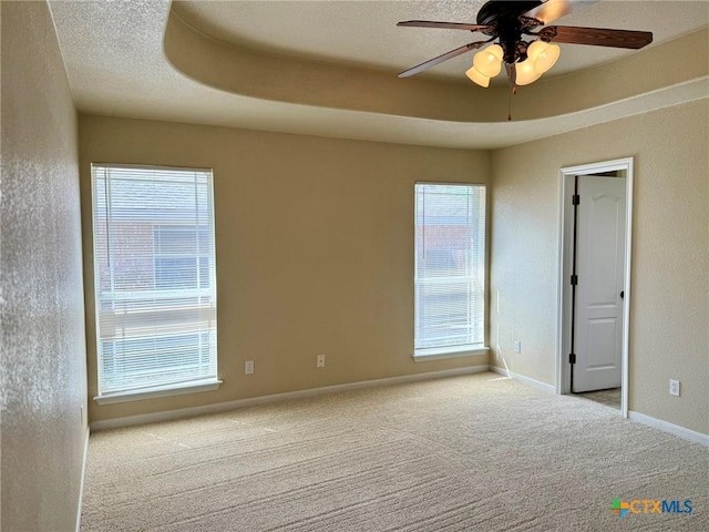 3508 Lucas St, Copperas Cove, TX 76522 - spare room featuring carpet floors, a ceiling fan, a textured wall, and baseboards