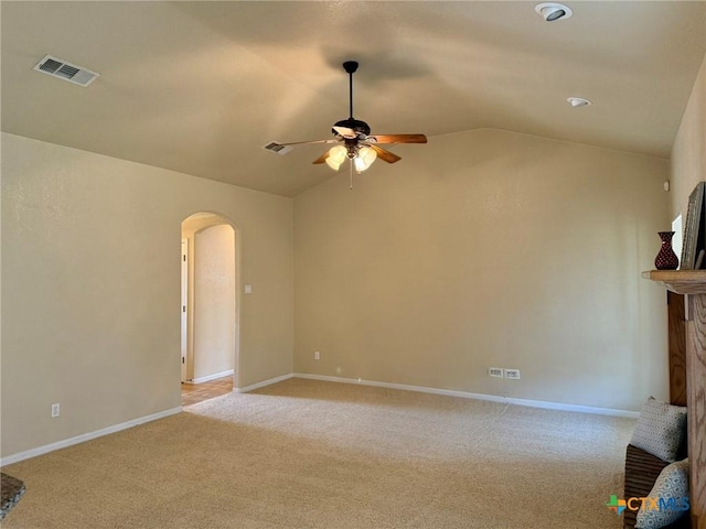 3508 Lucas St, Copperas Cove, TX 76522 - unfurnished living room with arched walkways, ceiling fan, lofted ceiling, light colored carpet, and baseboards