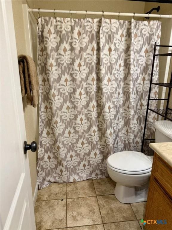 3508 Lucas St, Copperas Cove, TX 76522 - full bathroom with vanity, toilet, a shower with shower curtain, and tile patterned floors
