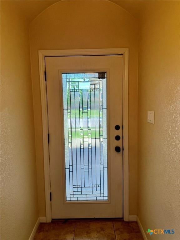 3508 Lucas St, Copperas Cove, TX 76522 - doorway to outside featuring baseboards and tile patterned flooring