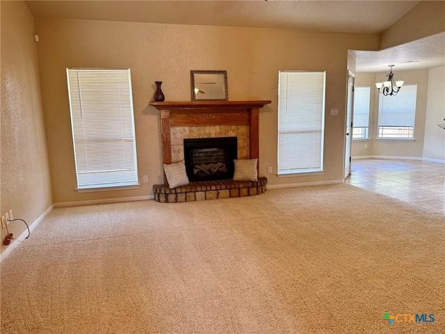 3508 Lucas St, Copperas Cove, TX 76522 - unfurnished living room featuring a chandelier, a tile fireplace, carpet flooring, and baseboards