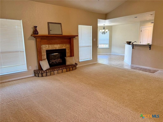 3508 Lucas St, Copperas Cove, TX 76522 - unfurnished living room with a chandelier, light carpet, vaulted ceiling, a fireplace with raised hearth, and baseboards