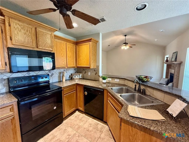 3508 Lucas St, Copperas Cove, TX 76522 - kitchen featuring black appliances, a sink, ceiling fan, decorative backsplash, and a fireplace with raised hearth
