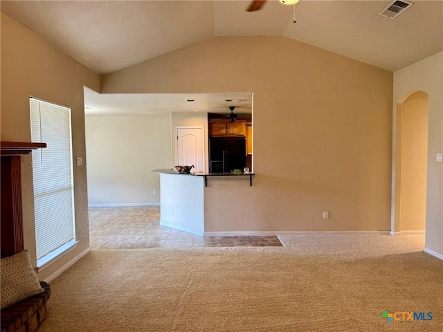 3508 Lucas St, Copperas Cove, TX 76522 - unfurnished living room featuring a ceiling fan, light carpet, arched walkways, lofted ceiling, and baseboards