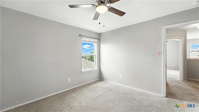 912 Bexley Dr, Seguin, TX 78155 - spare room with carpet flooring, healthy amount of natural light, ceiling fan, and a smoke detector