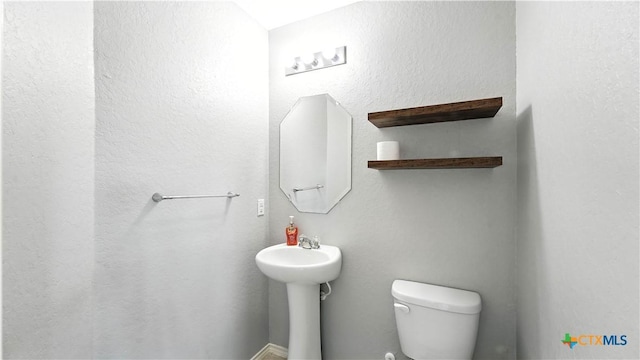 912 Bexley Dr, Seguin, TX 78155 - half bathroom featuring toilet and a sink
