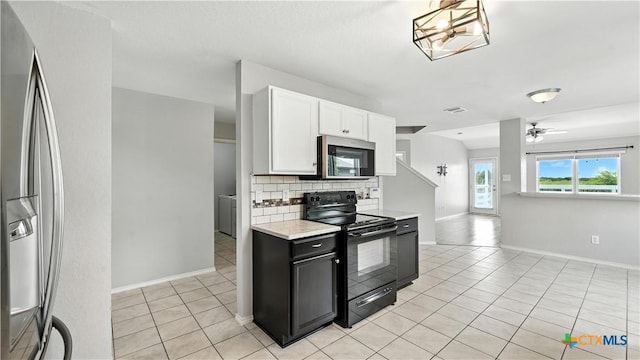 912 Bexley Dr, Seguin, TX 78155 - kitchen with appliances with stainless steel finishes, light tile patterned floors, decorative backsplash, and white cabinets