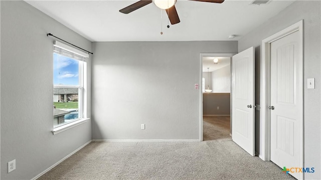 912 Bexley Dr, Seguin, TX 78155 - unfurnished bedroom with carpet floors and ceiling fan
