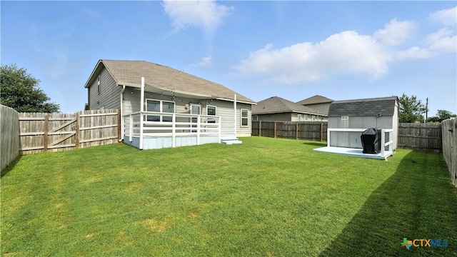 912 Bexley Dr, Seguin, TX 78155 - back of house featuring a storage unit and a fenced backyard