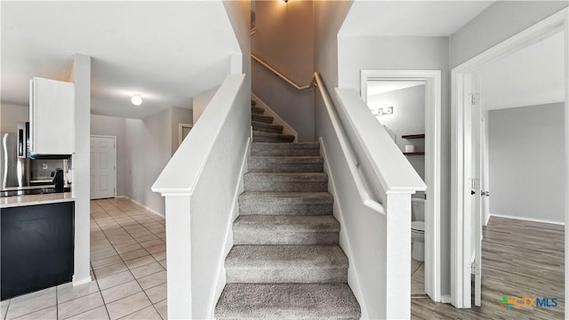 912 Bexley Dr, Seguin, TX 78155 - stairway with tile patterned floors and baseboards