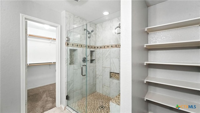 912 Bexley Dr, Seguin, TX 78155 - full bathroom featuring a shower stall and a walk in closet