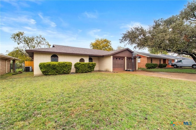 single story home featuring a garage, central air condition unit, and a front lawn