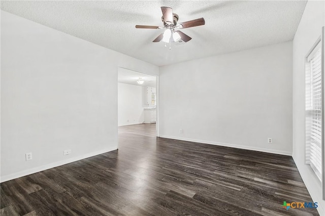 unfurnished room featuring a textured ceiling, dark hardwood / wood-style flooring, and ceiling fan