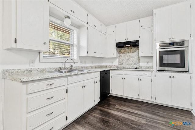 kitchen with sink, dark wood-type flooring, a textured ceiling, white cabinets, and black appliances