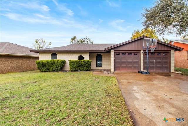 ranch-style house with a garage and a front lawn