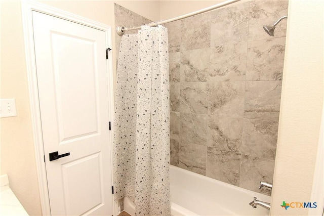 bathroom featuring shower / bath combination with curtain