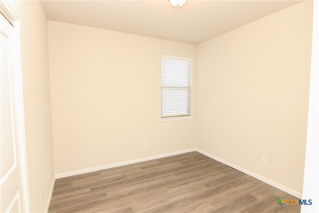 empty room featuring wood-type flooring