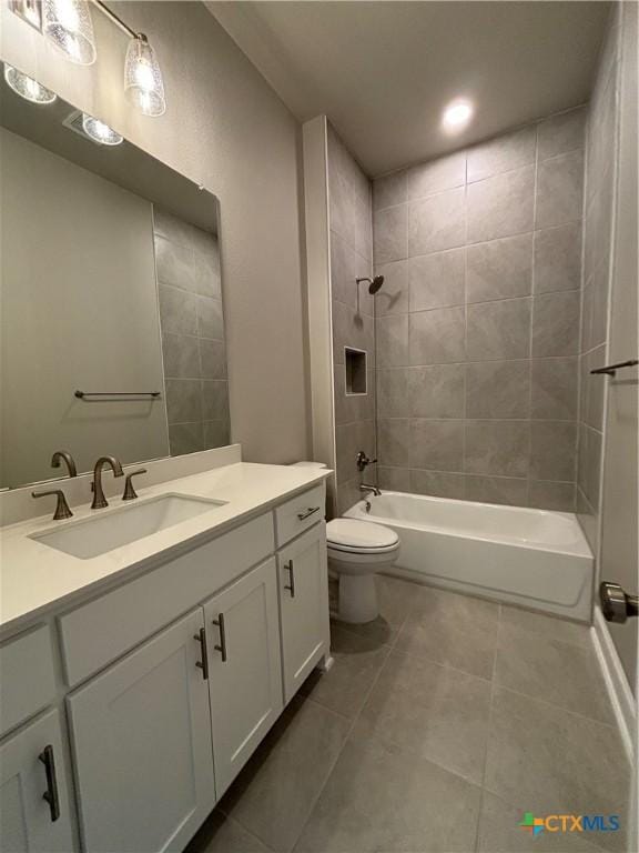 full bath with tile patterned flooring, shower / bath combination, vanity, and toilet