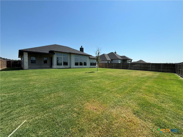 view of yard featuring a fenced backyard