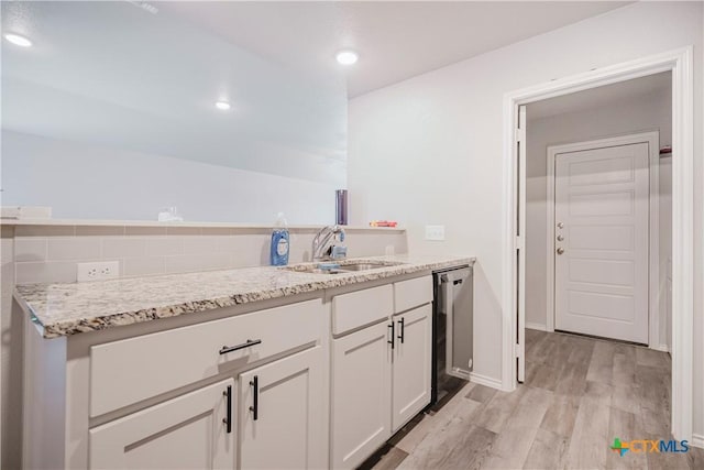 interior space with sink and hardwood / wood-style floors