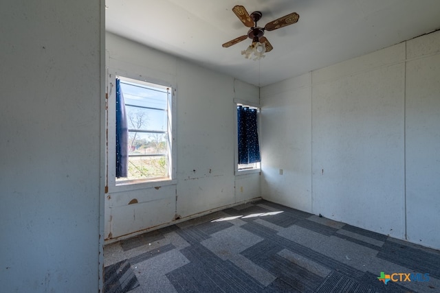 unfurnished room with ceiling fan