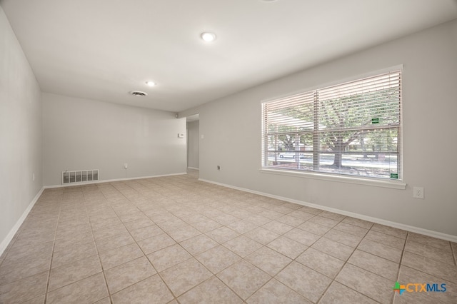 spare room with light tile patterned floors