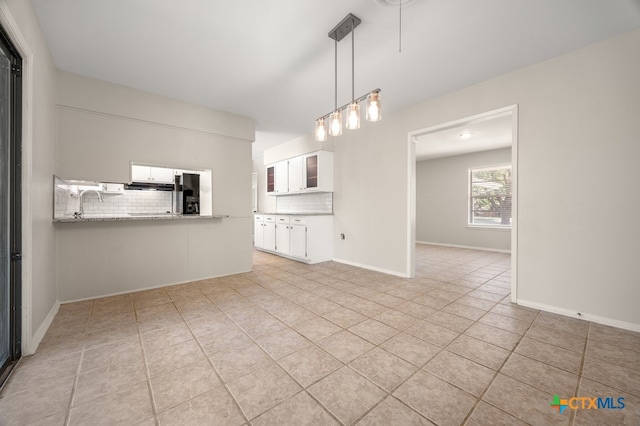 unfurnished living room featuring light tile patterned floors