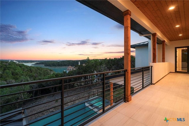 balcony at dusk with a water view