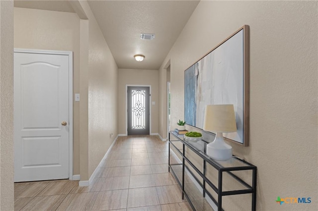 2226 Hayes St, Temple, TX 76502 - entryway with light tile patterned floors and a textured wall