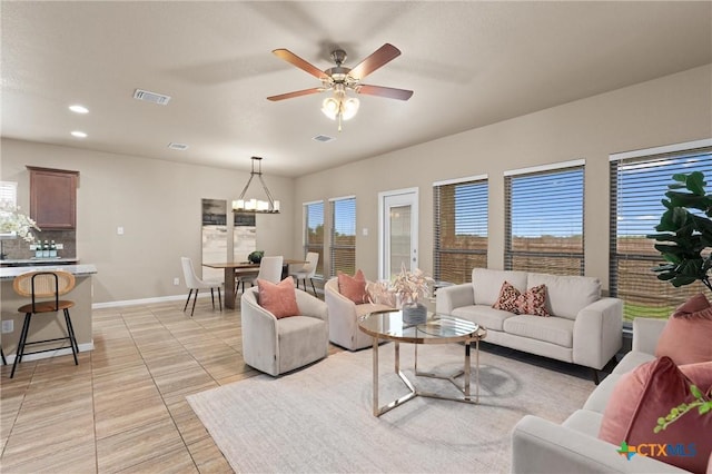 2226 Hayes St, Temple, TX 76502 - living room with a chandelier, recessed lighting, a ceiling fan, and light tile patterned floors