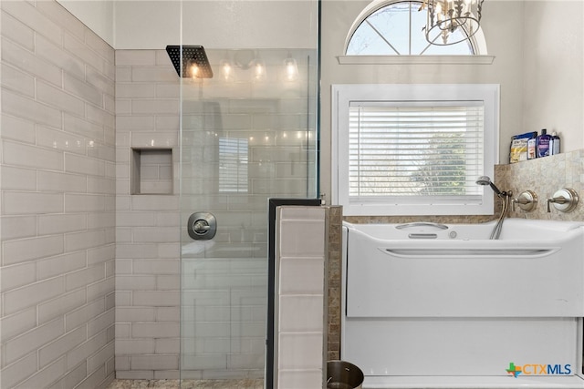 bathroom with a healthy amount of sunlight and tiled shower