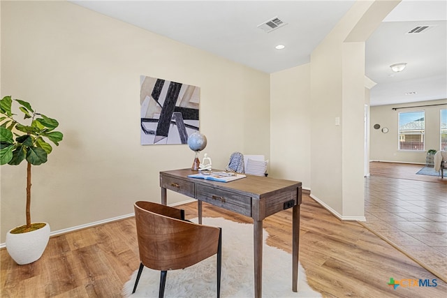 office space with hardwood / wood-style flooring