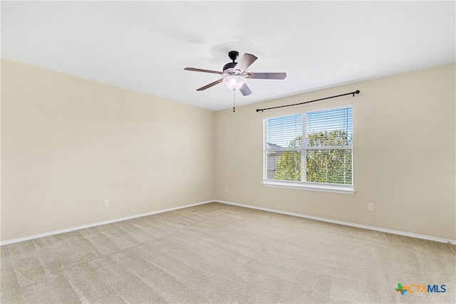 empty room with light carpet and ceiling fan