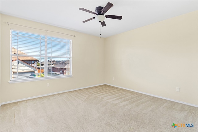 empty room with carpet and ceiling fan